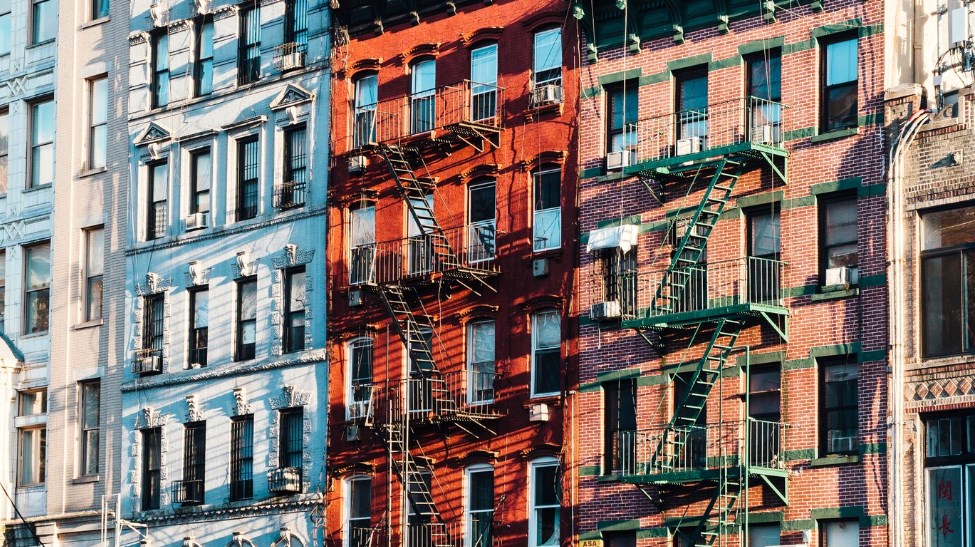 colorful facades of a building with fire escapes