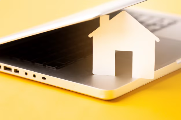 Cardboard house covered with laptop lid